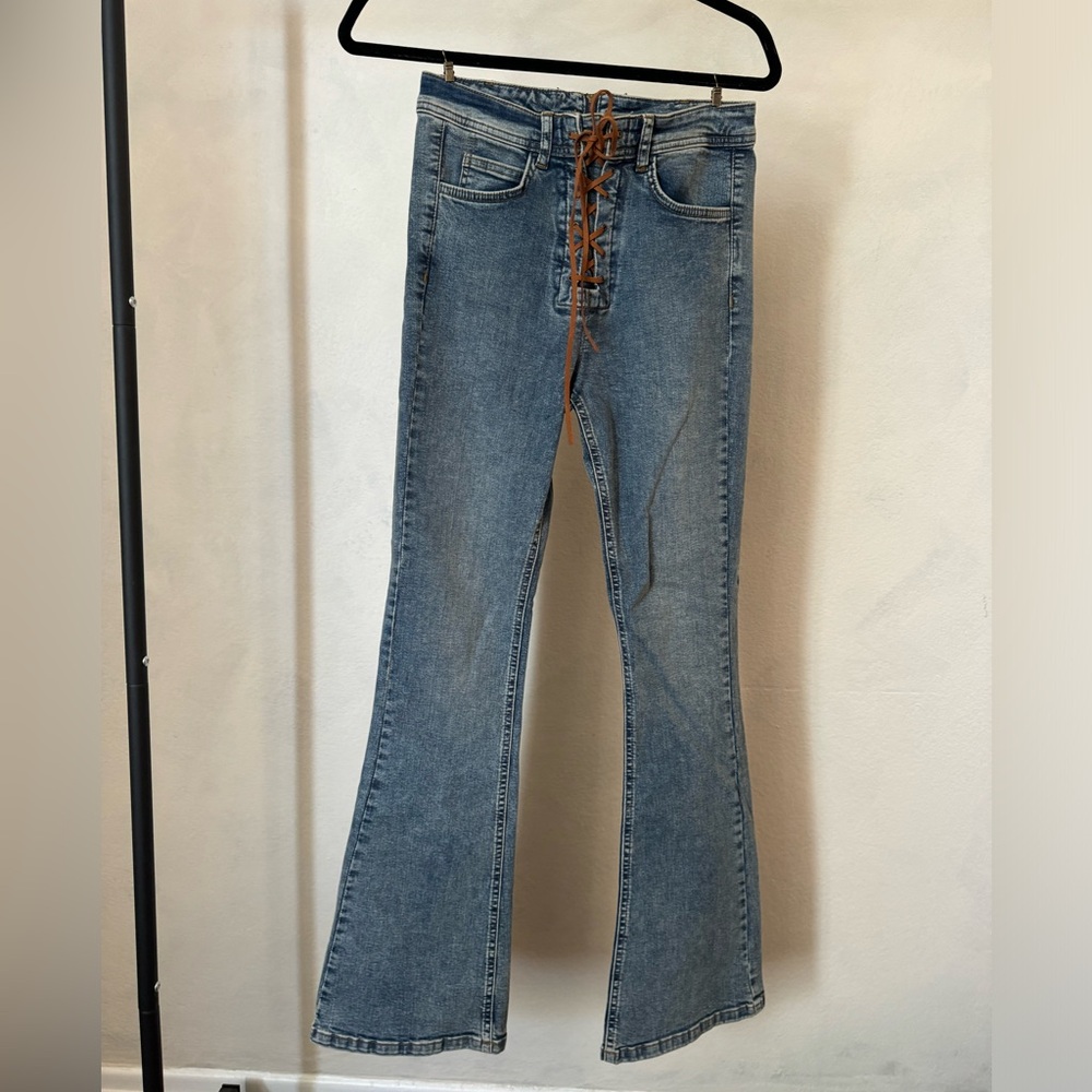 Lace up flare bottom jeans